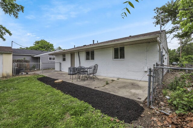 3749 Dort Pl, Columbus, OH 43227 - rear view of house featuring a patio area and brick siding