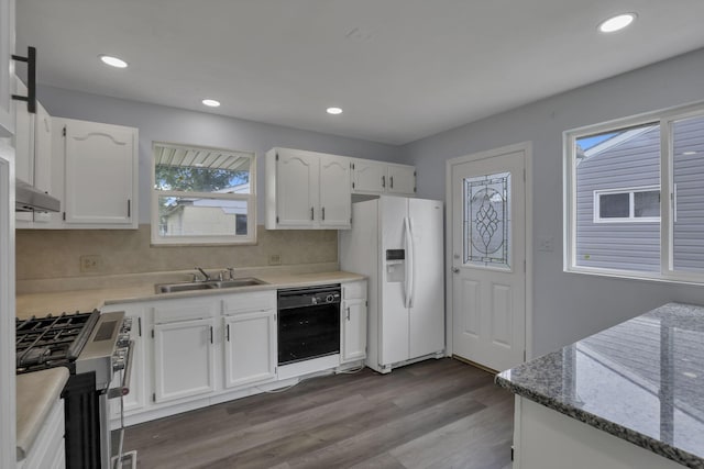 3749 Dort Pl, Columbus, OH 43227 - kitchen with white refrigerator with ice dispenser, dishwasher, stainless steel gas range, white cabinetry, and recessed lighting