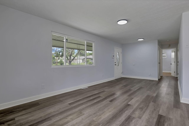 3749 Dort Pl, Columbus, OH 43227 - empty room featuring baseboards and dark wood-type flooring