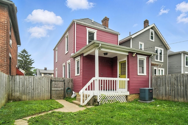 626 S 22nd St, Columbus, OH 43205 - rear view of house with a gate, a fenced backyard, and a chimney