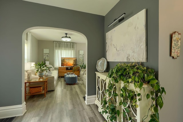 1332 E Deshler Ave, Columbus, OH 43206 - hall featuring arched walkways and wood finished floors
