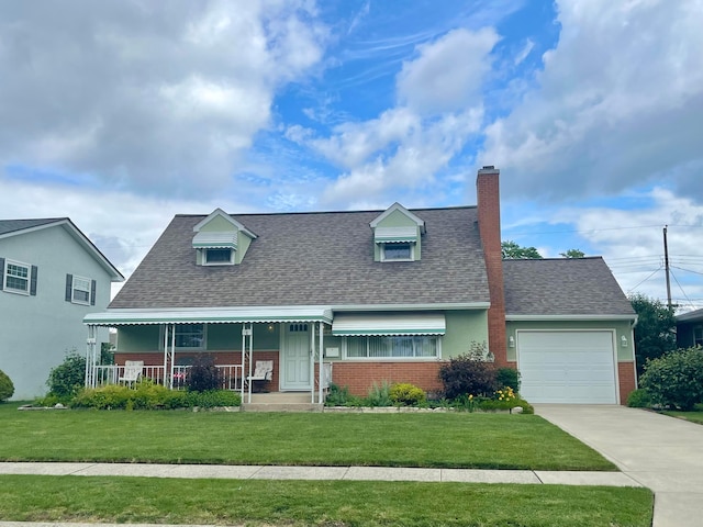 2666 Eugene Ave, Grove City, OH 43123 - cape cod-style house with brick siding, an attached garage, a front lawn, and a shingled roof