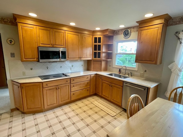 2666 Eugene Ave, Grove City, OH 43123 - kitchen with appliances with stainless steel finishes, light countertops, brown cabinetry, tasteful backsplash, and recessed lighting