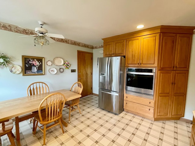 2666 Eugene Ave, Grove City, OH 43123 - kitchen featuring stainless steel appliances, ceiling fan, light flooring, brown cabinetry, and recessed lighting