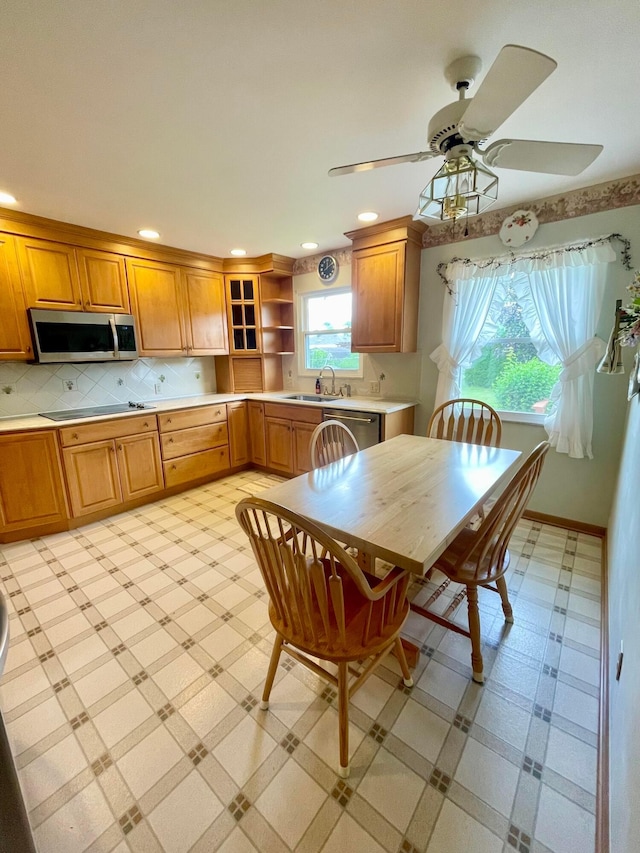 2666 Eugene Ave, Grove City, OH 43123 - kitchen featuring appliances with stainless steel finishes, light countertops, recessed lighting, open shelves, and brown cabinetry