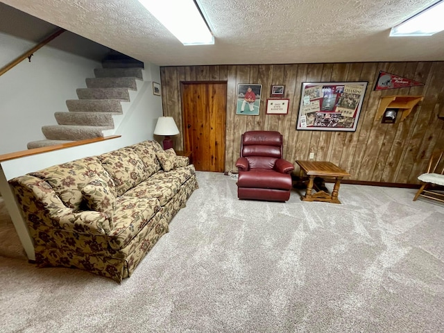 2666 Eugene Ave, Grove City, OH 43123 - living area with carpet flooring, stairway, wood walls, and a textured ceiling