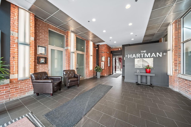 150 E Main St Unit 512, Columbus, OH 43215 - building lobby featuring brick wall and recessed lighting