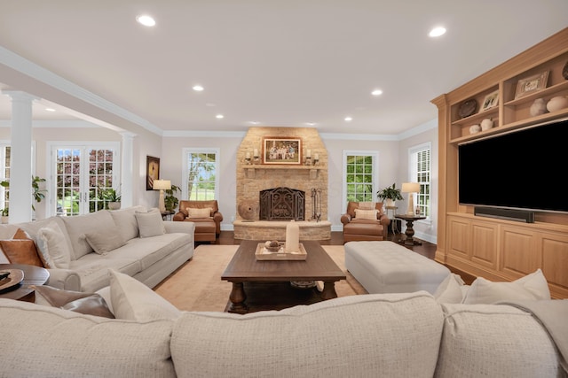10277 Mackenzie Way, Dublin, OH 43017 - living area with recessed lighting, ornate columns, light wood finished floors, ornamental molding, and a fireplace