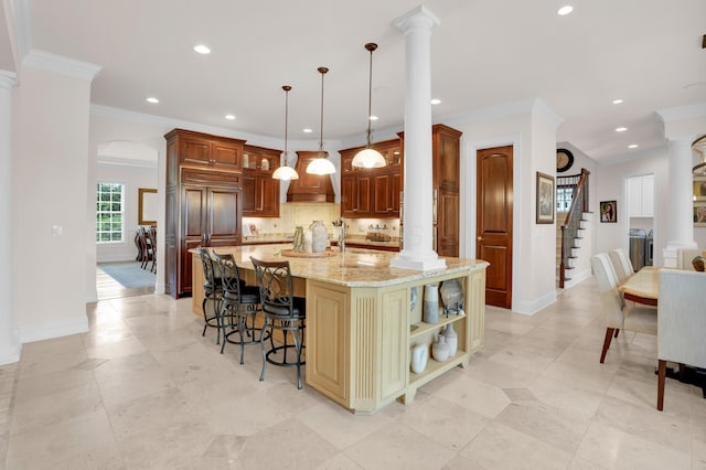 10277 Mackenzie Way, Dublin, OH 43017 - kitchen with washer and clothes dryer, light stone countertops, decorative backsplash, recessed lighting, and open shelves