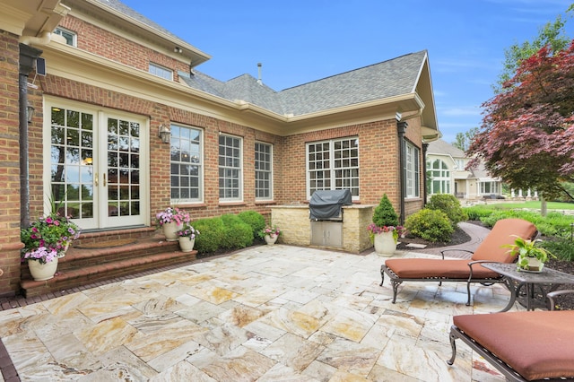 10277 Mackenzie Way, Dublin, OH 43017 - view of patio featuring french doors and an outdoor kitchen
