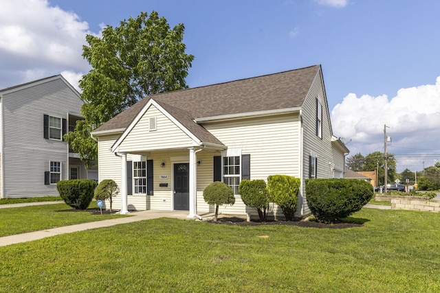 1664 S Champion Ave, Columbus, OH 43207 - view of front of house featuring a front yard and roof with shingles