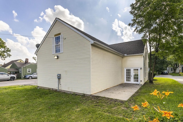 1664 S Champion Ave, Columbus, OH 43207 - view of property exterior with french doors and a lawn