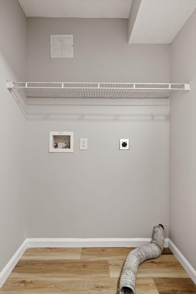 1664 S Champion Ave, Columbus, OH 43207 - laundry area featuring electric dryer hookup, washer hookup, and light wood-type flooring
