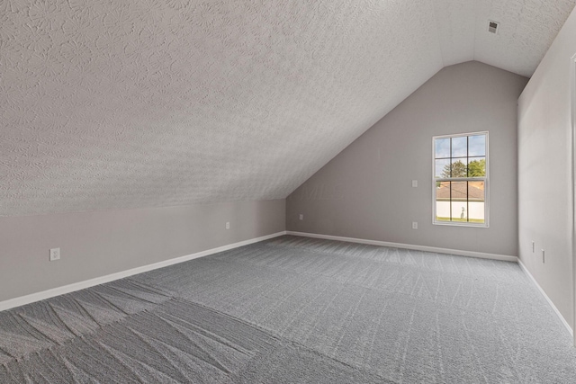 1664 S Champion Ave, Columbus, OH 43207 - bonus room with a textured ceiling, vaulted ceiling, and carpet flooring