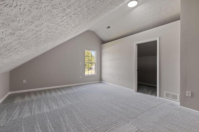 1664 S Champion Ave, Columbus, OH 43207 - bonus room with carpet, vaulted ceiling, and a textured ceiling