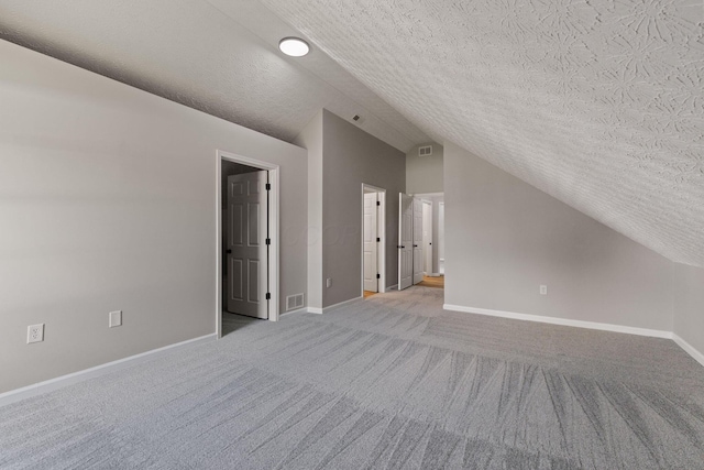 1664 S Champion Ave, Columbus, OH 43207 - bonus room with lofted ceiling, a textured ceiling, and light carpet