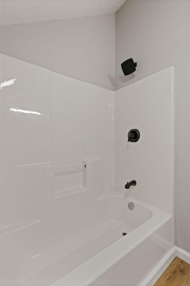 1664 S Champion Ave, Columbus, OH 43207 - full bath featuring shower / bath combination and wood finished floors