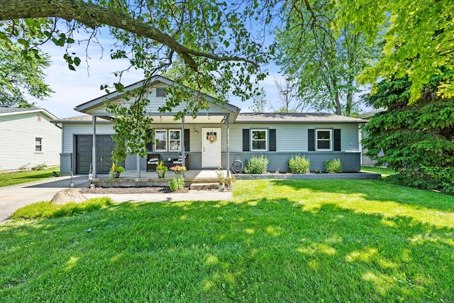 876 Kirkwood Dr, West Jefferson, OH 43162 - ranch-style home featuring covered porch, a front yard, driveway, brick siding, and an attached garage