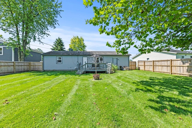 876 Kirkwood Dr, West Jefferson, OH 43162 - rear view of house with a deck and a fenced backyard