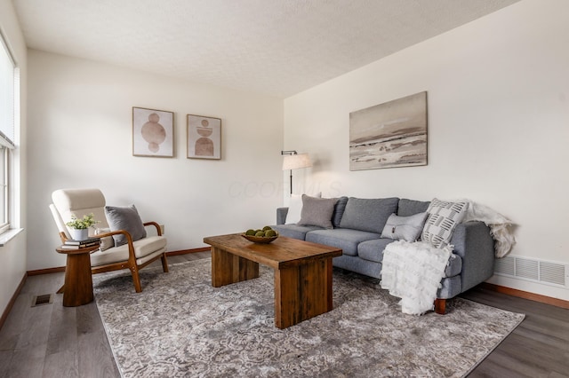 3351 Lindstrom Dr, Columbus, OH 43228 - living area featuring wood finished floors and a textured ceiling