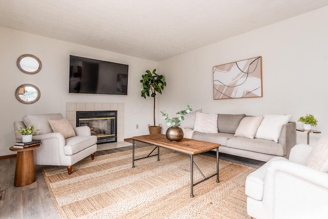 3351 Lindstrom Dr, Columbus, OH 43228 - living area featuring wood finished floors and a tiled fireplace