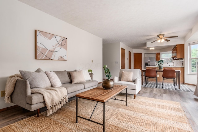 3351 Lindstrom Dr, Columbus, OH 43228 - living room featuring light wood finished floors and a ceiling fan