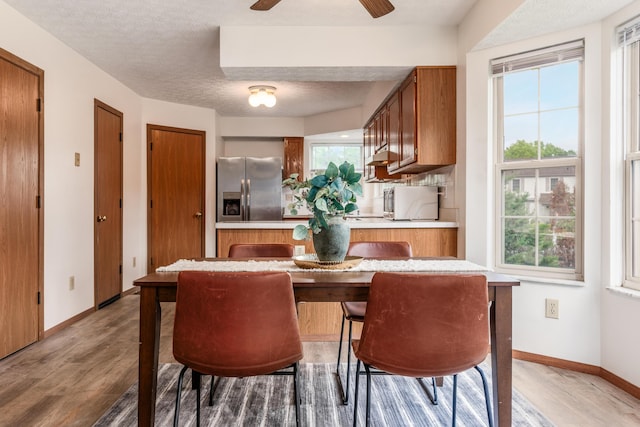 3351 Lindstrom Dr, Columbus, OH 43228 - dining area featuring light wood finished floors and plenty of natural light