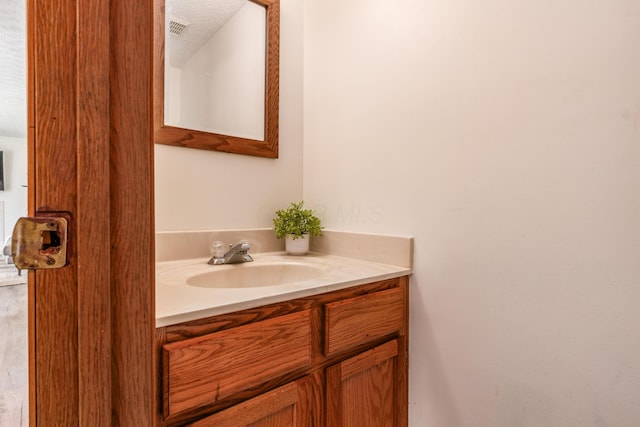3351 Lindstrom Dr, Columbus, OH 43228 - bathroom featuring vanity and a textured ceiling