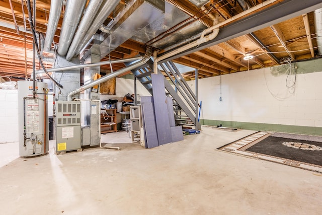 3351 Lindstrom Dr, Columbus, OH 43228 - unfinished below grade area featuring water heater, stairs, and heating unit