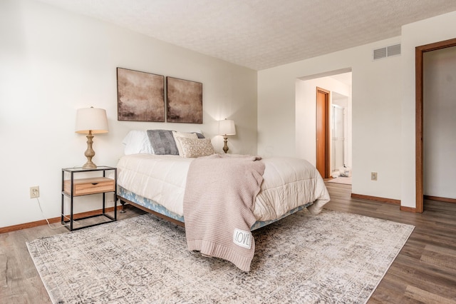 3351 Lindstrom Dr, Columbus, OH 43228 - bedroom with wood finished floors and a textured ceiling