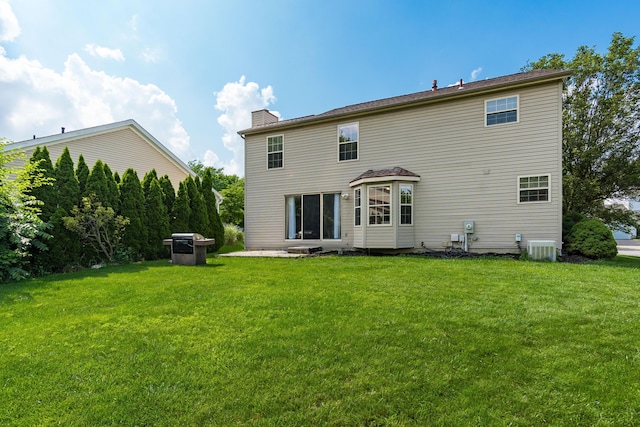 3351 Lindstrom Dr, Columbus, OH 43228 - back of house with a lawn and a chimney