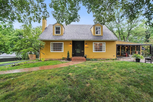 2620 Edgevale Rd, Columbus, OH 43221 - cape cod-style house with a front lawn, a sunroom, a chimney, and roof with shingles