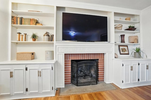 2620 Edgevale Rd, Columbus, OH 43221 - living area featuring light wood-style floors, a brick fireplace, and built in features