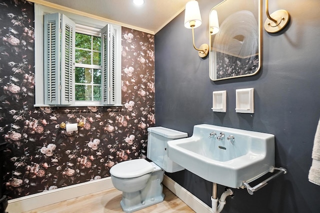 2620 Edgevale Rd, Columbus, OH 43221 - half bath featuring ornamental molding, wood finished floors, and wallpapered walls
