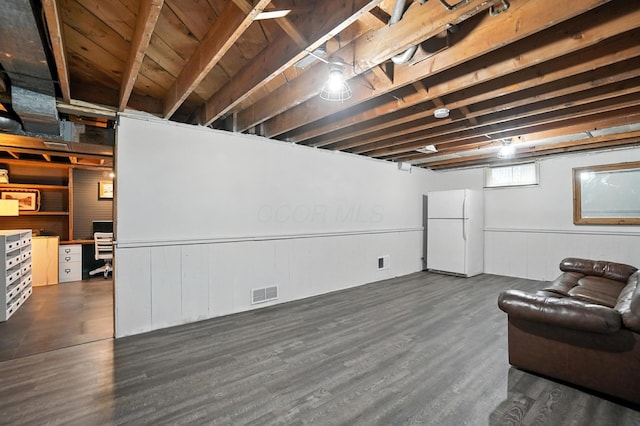 2620 Edgevale Rd, Columbus, OH 43221 - basement with freestanding refrigerator, dark wood finished floors, and a wainscoted wall