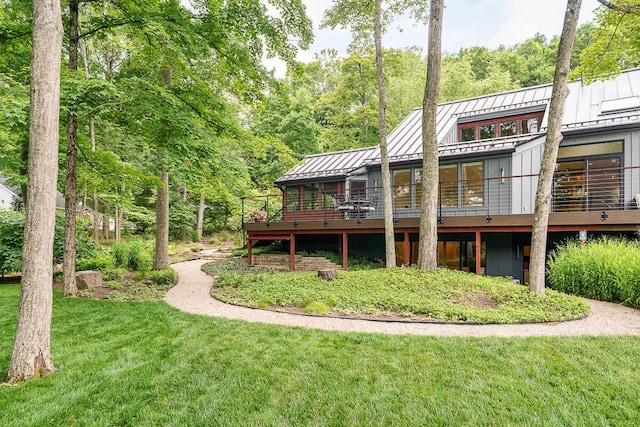 150 Pinehurst Dr, Granville, OH 43023 - rear view of house with a standing seam roof, a metal roof, a yard, and a wooden deck