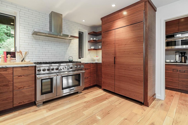 150 Pinehurst Dr, Granville, OH 43023 - kitchen featuring appliances with stainless steel finishes, wall chimney range hood, open shelves, tasteful backsplash, and recessed lighting