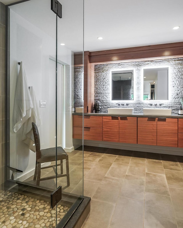 150 Pinehurst Dr, Granville, OH 43023 - bathroom featuring double vanity, decorative backsplash, a stall shower, and recessed lighting