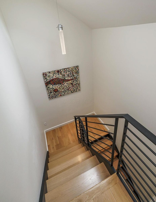 150 Pinehurst Dr, Granville, OH 43023 - staircase with wood finished floors and lofted ceiling