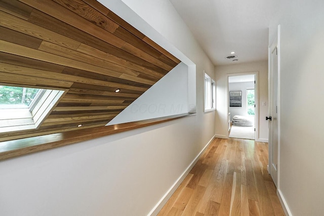 150 Pinehurst Dr, Granville, OH 43023 - hallway featuring a skylight, recessed lighting, and wood finished floors