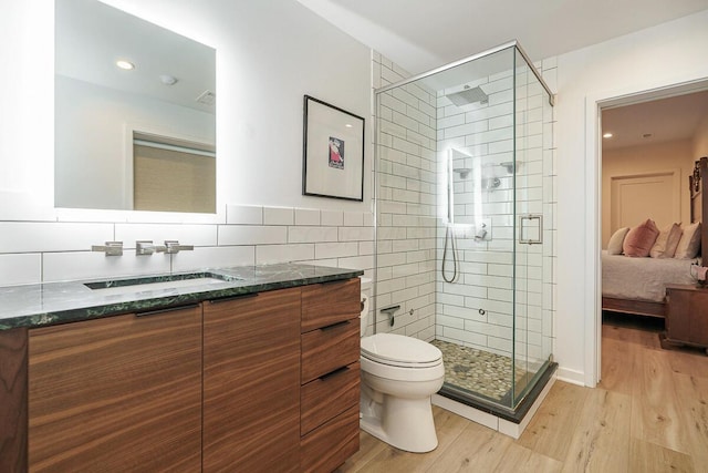 150 Pinehurst Dr, Granville, OH 43023 - ensuite bathroom featuring vanity, wood finished floors, a stall shower, and recessed lighting