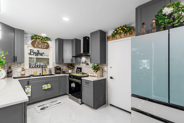 1174 Belden Rd, Columbus, OH 43229 - kitchen featuring range, wall chimney exhaust hood, light countertops, tasteful backsplash, and gray cabinets