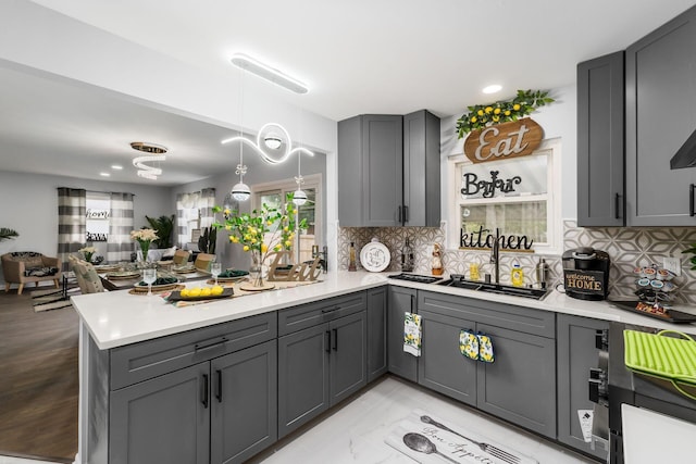 1174 Belden Rd, Columbus, OH 43229 - kitchen with gray cabinets, a peninsula, tasteful backsplash, and recessed lighting