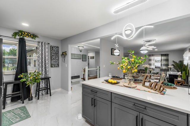 1174 Belden Rd, Columbus, OH 43229 - kitchen with gray cabinetry, light countertops, decorative light fixtures, and recessed lighting