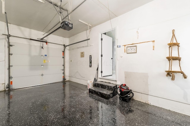 1174 Belden Rd, Columbus, OH 43229 - garage with a garage door opener and baseboards