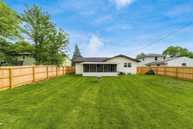 1174 Belden Rd, Columbus, OH 43229 - back of property featuring a sunroom and a fenced backyard