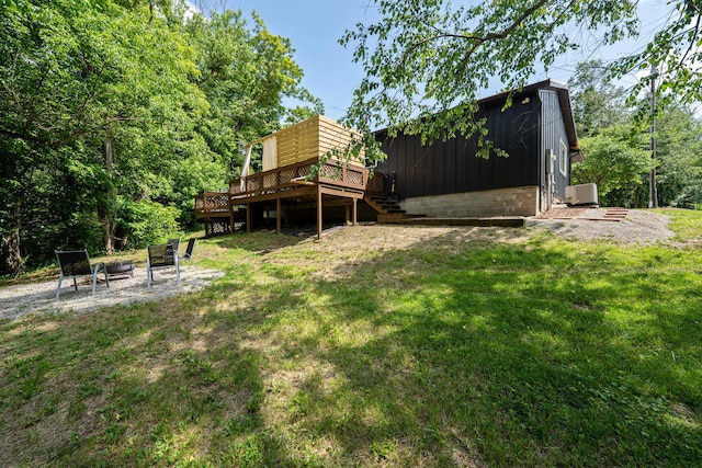 63775 State Route 56, Creola, OH 45622 - view of green lawn with an outdoor fire pit and a deck
