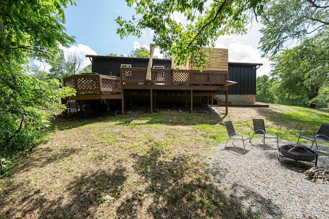 63775 State Route 56, Creola, OH 45622 - back of house with a fire pit, board and batten siding, and a deck