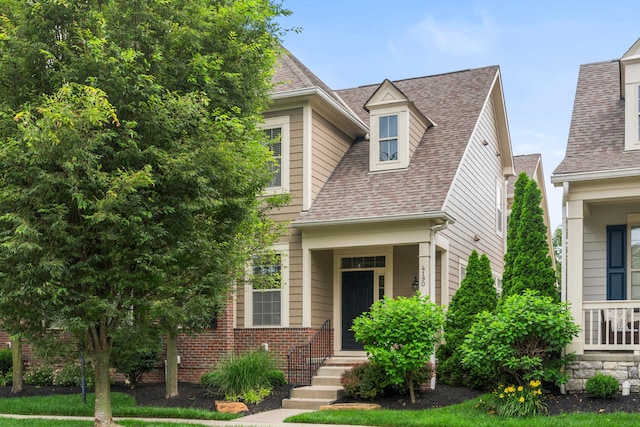 4190 Troutbrook Dr Unit 128, Dublin, OH 43017 - view of front of home with roof with shingles and brick siding