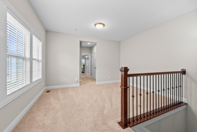 4190 Troutbrook Dr Unit 128, Dublin, OH 43017 - corridor with carpet and an upstairs landing